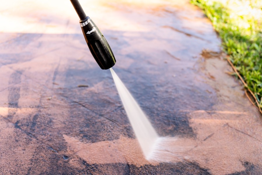High pressure cleaning on backyard tile area